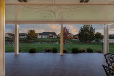 large white patio cover over a dark brown patio in Boise, Idaho.