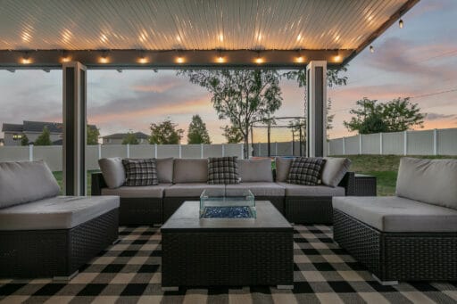 grey and white patio cover with checkered black and white patio furniture