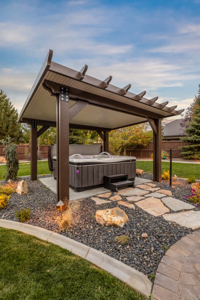 brown and tan detached patio cover over a colorful hot tub in Meridian, Idaho.