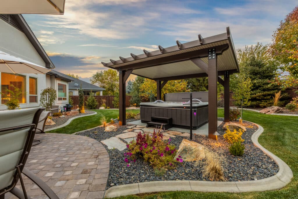 brown and tan detached patio cover over a colorful hot tub